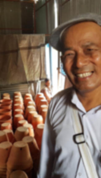 Dil Krishna Prajapati with the new kilns in Bhaktapur, Nepal, funded by World Crafts Council - Australia after the April 2014 Kathmandu earthquake